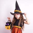 Young girl wearing a witch costume