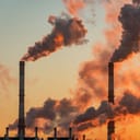 Industrial chimney releasing fumes into the air
