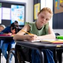 schoolgirl in a wheelchair in a classroom, representing inclusivity in education