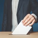 A man placing his vote in a poll box