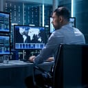 Cybersecurity expert sitting at a computer