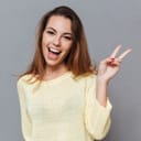 Happy looking woman giving a positive sign with her hand