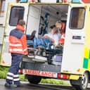 Paramedics placing a patient into an ambulence