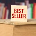 book displayed with a wooden sign on it saying 'bestseller' in a bookstore
