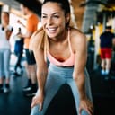 Close up image of attractive fit woman in gym