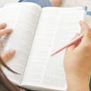closeup of a person looking at an open book