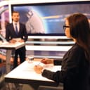Two political candidates having a debate on a panel