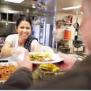 Woman working at a soup kitchen