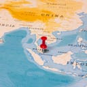 A pin placed on Singapore on a map