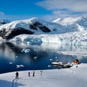 Research station on a lake in winter with people visiting