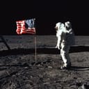 Astronaut Buzz Aldrin, lunar module pilot of the first lunar landing mission, poses for a photograph beside the deployed United States flag during an Apollo 11 Extravehicular Activity on the lunar surface