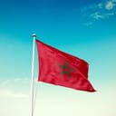 flag of Morocco waving against blue sky