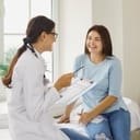 Woman talking with her doctor at a checkup