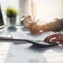 Tax deduction planning concept. Businessman calculating business balance prepare tax reduction.
