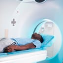 A man going through a CT scan