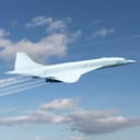 Concorde airplane flying among clouds