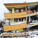 Exterior of a residence building destroyed by an earthquake