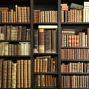 Collection of old books on a shelf.