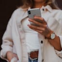 young woman holding a smartphone in her hand