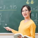 Teacher pointing at the blackboard