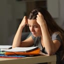 Studious student studying hard late hours in the night at home