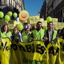 Greenpeace activists and supporters in Madrid march for climate action with banners ahead of the COP21 conference in Paris on November 29, 2015.