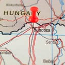 Map border between Hungary and Serbia with a pin dropped on the Serbian town of Subotica near the borderline