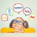 Cute little girl with eyeglasses looking at 'hello' word in multiple languages