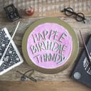 Cake decorated with 'happee birthdae thandy' lettering