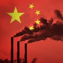 Artistic depiction of Chinese national flag superimposed on three chimneys emitting thick fumes into air