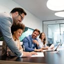 People laughing during business meeting in an office