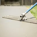 fresh concrete poured and reinforced with rebar for a patio construction