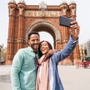 A couple taking a selfie in front a monument