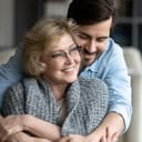 A young man hugging his mother