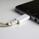 an old phone charger with broken cord