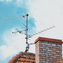 close-up of a TV antenna mounted atop a building