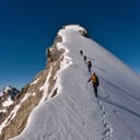 Group of mountaineers climbing to the summit