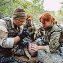British special forces soldiers with weapons during the rescue operation. war, army, technology and people concept.