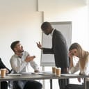 Two co-workers arguing during a meeting