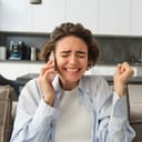 Image of brunette girl receive great news over the phonE