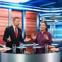 panel of four experts along with a TV host, two people engaged in a lively debate on politics