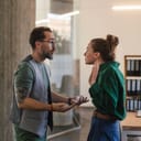 close-up of two colleagues in a dispute at the office