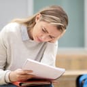 woman frowning while reading