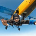 A ski diver jumping out of an airplane