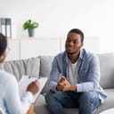 young man talking with a therapist