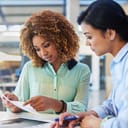 Human resources, interview and resume with a woman manager and candidate meeting at work. Business, contract and review with a female employer working on recruitment or hiring of staff in the office
