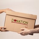 One person handing a donation box to another
