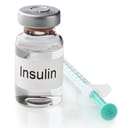 Vial of insulin and a syringe