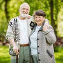 Elderly couple sharing a hug