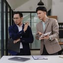 An angry businessman confronting his colleague about a problematic document at work, reminding him of deadlines.
